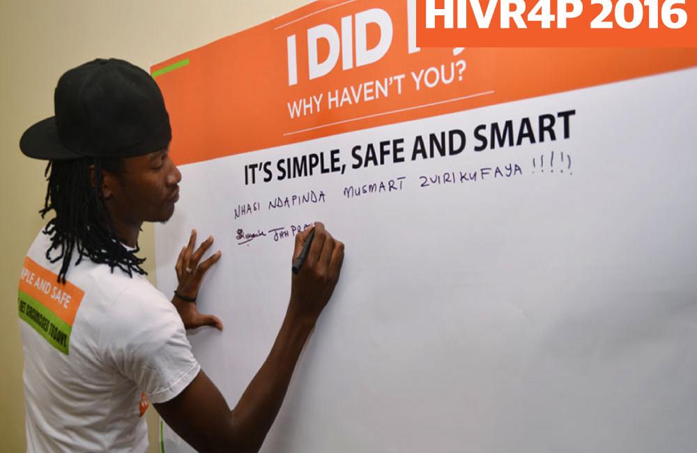 Popular Zimbabwe musician Jah Prayzah signing the Pride Board at a male circumcision site as part of a PSI campaign. Image credit: PSI