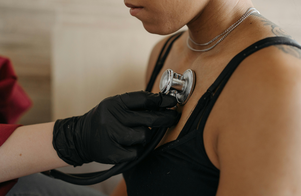 Pavel Danilyuk/Pexels A woman is having her chest listened to with a stethoscope.