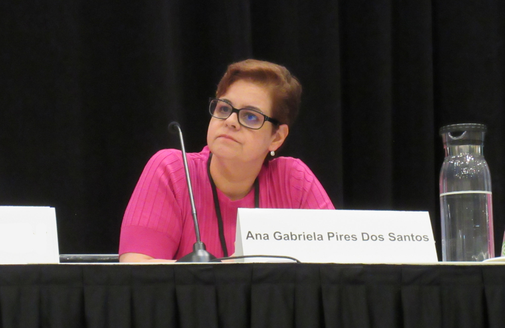 Dr Ana Gabriela Pires Dos Santos at CROI 2026. She is sitting down, with a small microphone in front of her.