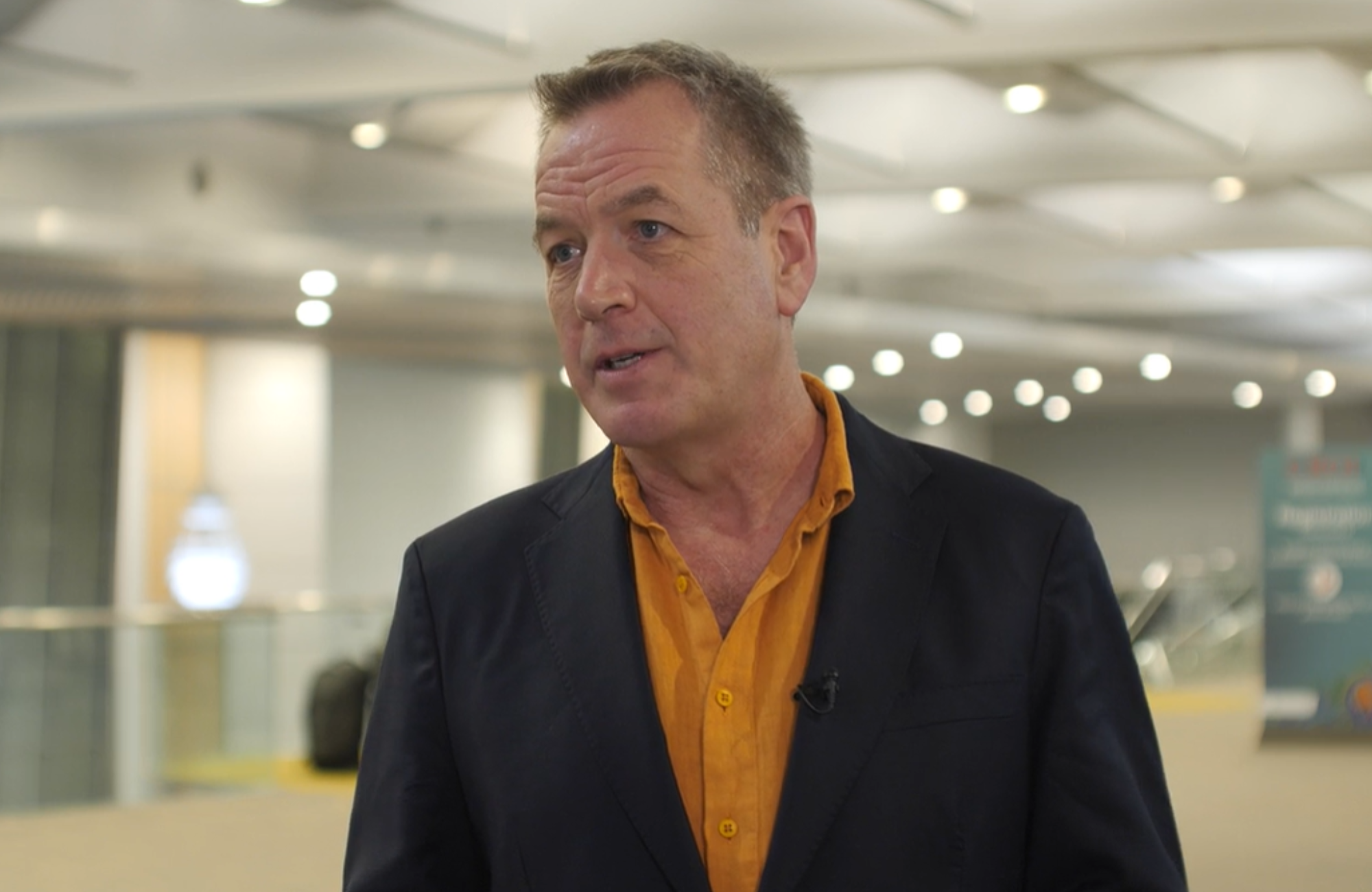 Dr Andrew Hill at CROI 2026. He is being interviewed at the CROI conference centre.