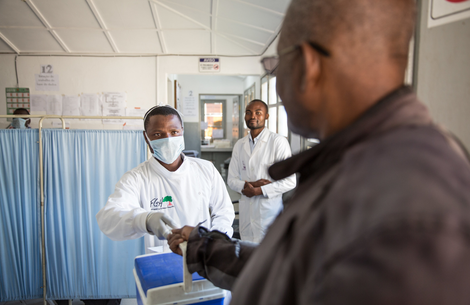 A courier collects HIV viral load samples at a rural health clinic in Mozambique.