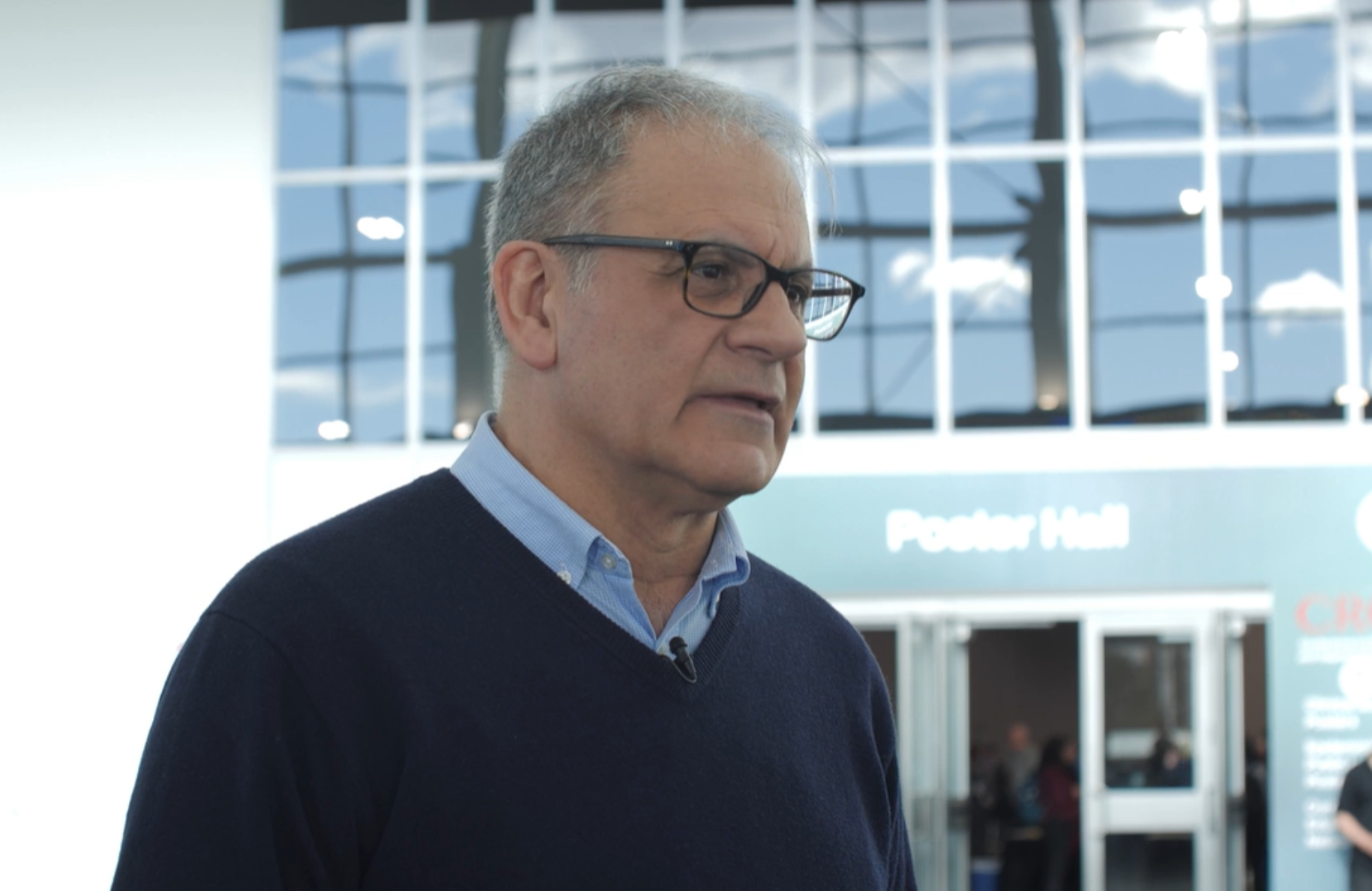 Dr Esteban Martinez at CROI 2026. He is being interviewed at the CROI conference centre.