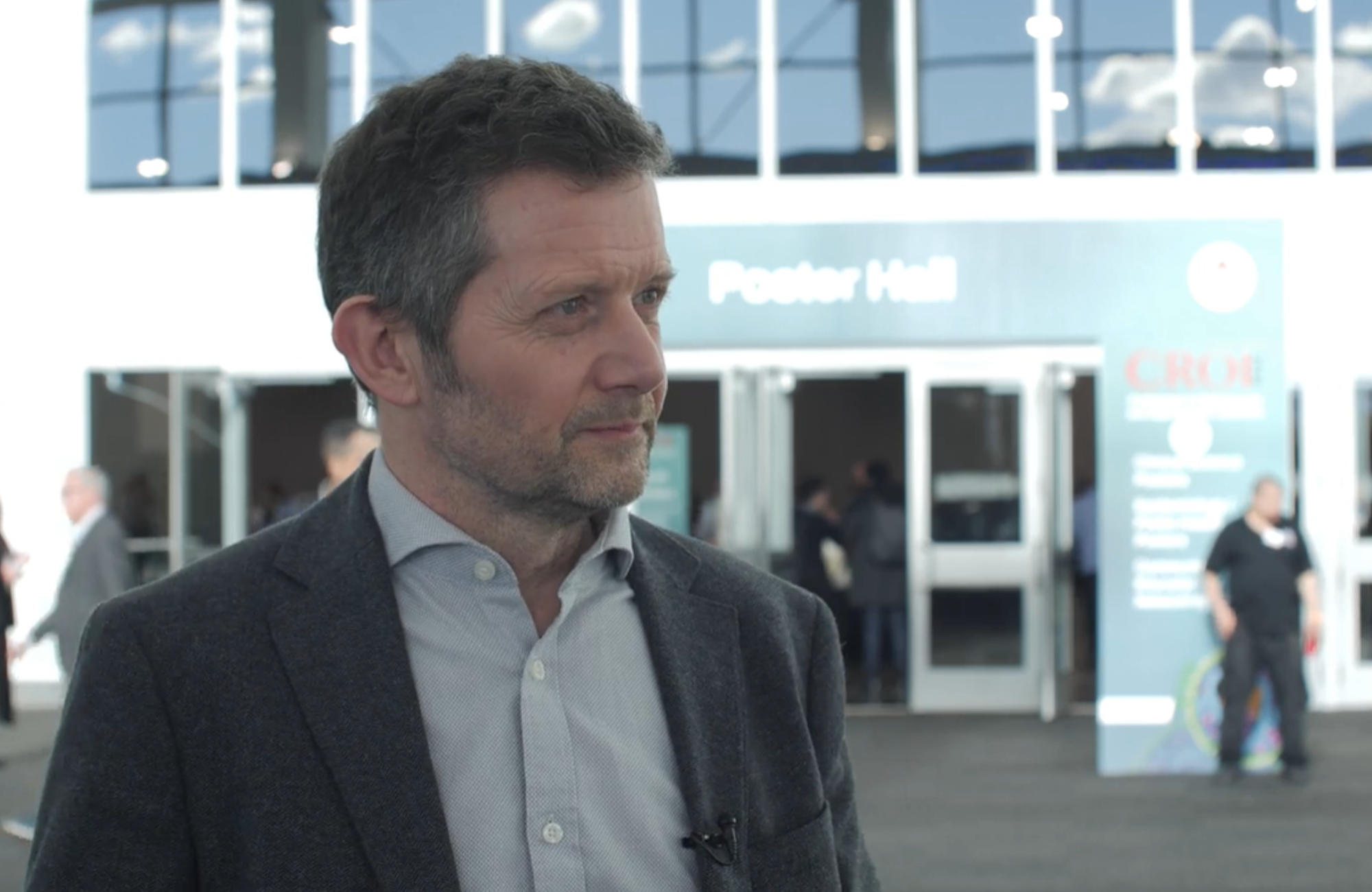 Professor John Frater at CROI 2026. He is being interviewed at the CROI conference centre.