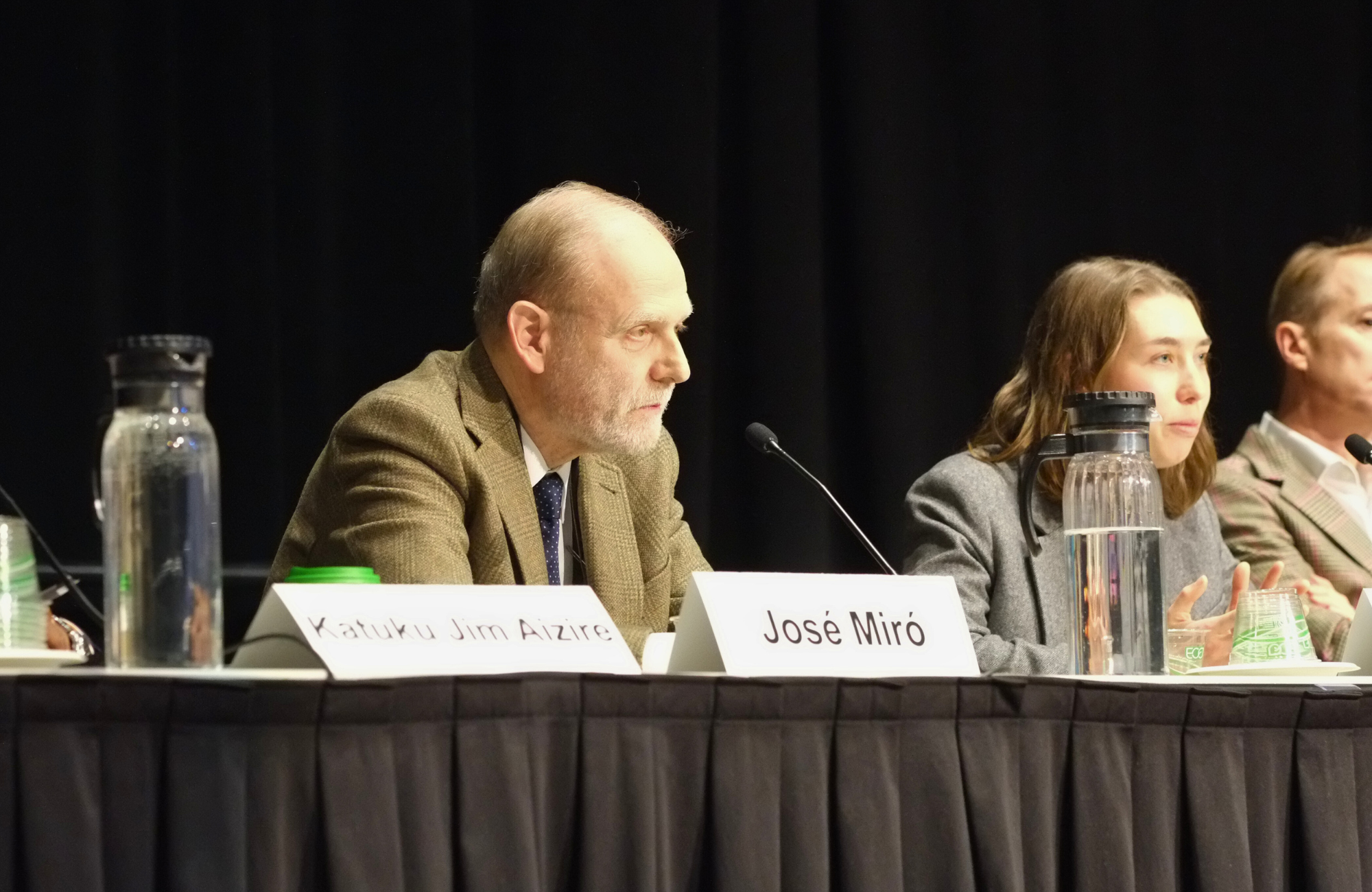 Dr José Miró at CROI 2026. He is sitting down, talking into a microphone, with two people sitting to his right.