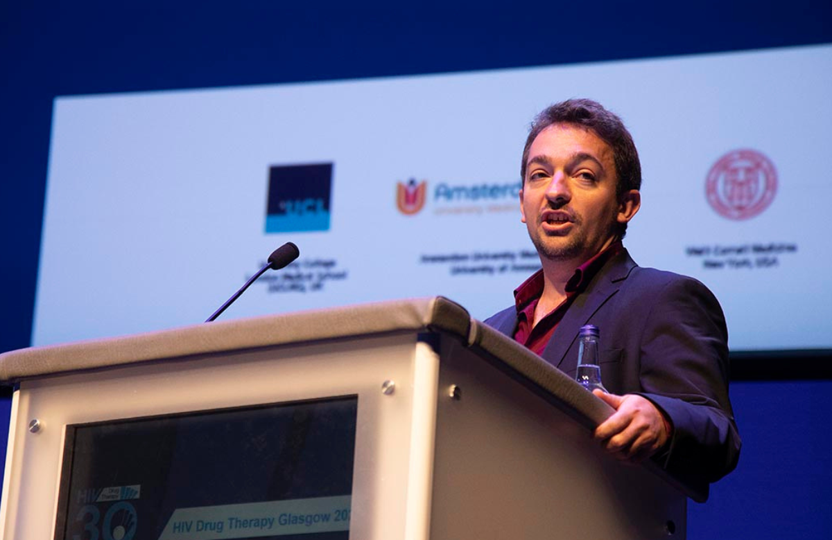 Dr Maxime Hentzien presenting at HIV Glasgow 2022. Image by Alan Donaldson Photography.