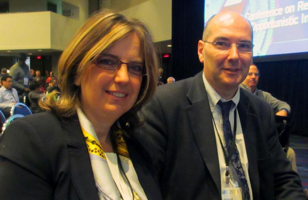 Isabelle Poizot-Martin and Laurent Cotte at CROI 2013. © Liz Highleyman / hivandhepatitis.com