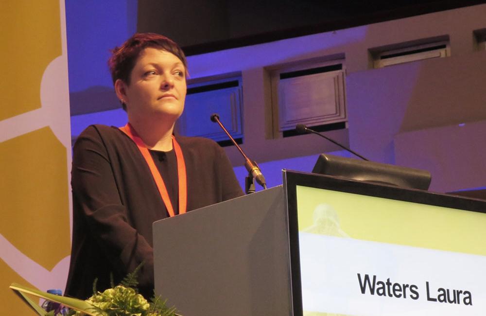 Laura Waters of Mortimer Market Centre speaking at EACS 2013. Photo by Liz Highleyman, hivandhepatitis.com
