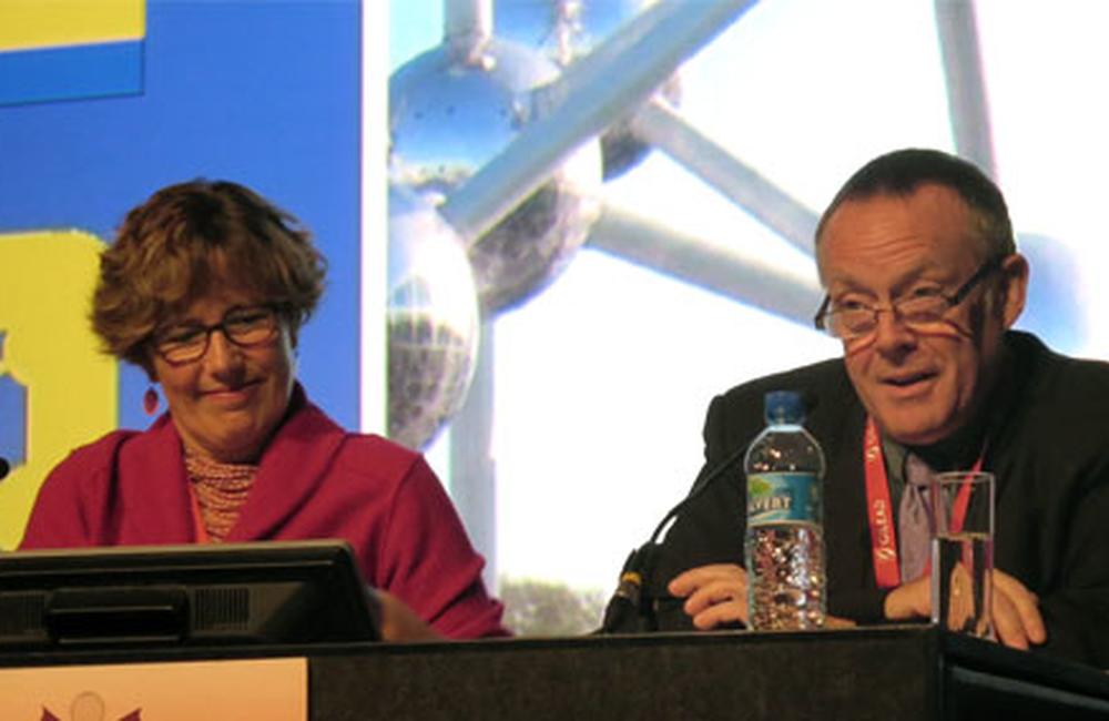 Sheena McCormack, of the UK Medical Research Centre Clinical Trials Unit, and Gus Cairns, of EATG and NAM, speaking at EACS 2013. Photo © Liz Highleyman / hivandhepatitis.com.