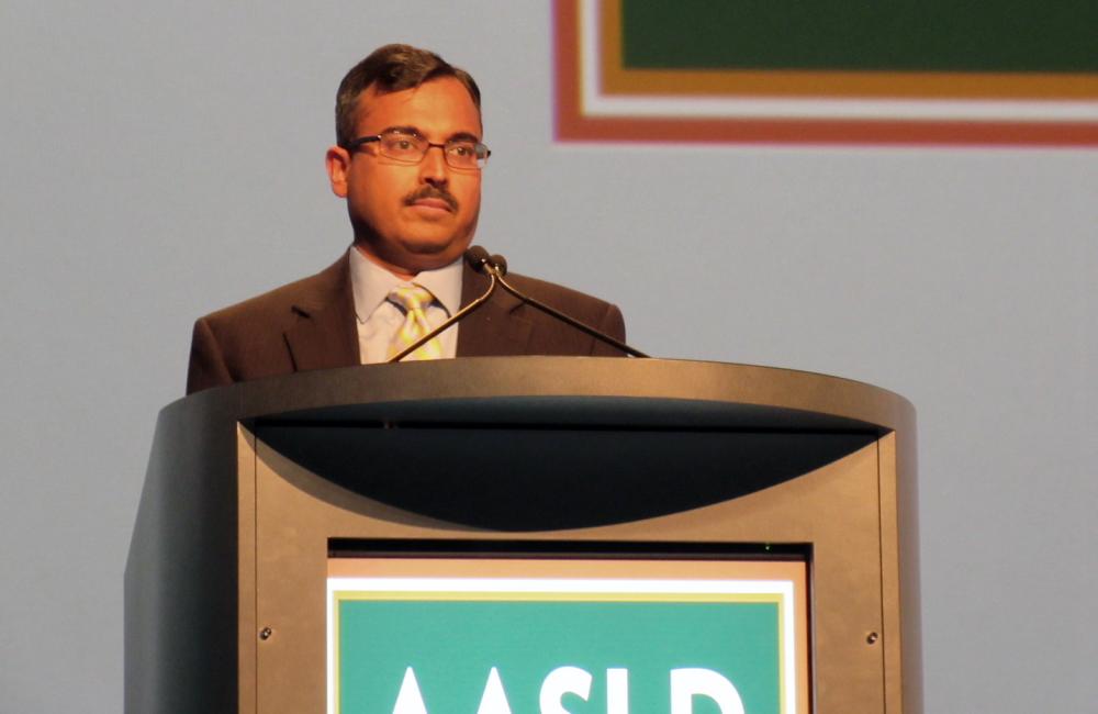 Shyam Kottilil speaking at the American Association for the Study of Liver Diseases (AASLD) Liver Meeting. Photo by Liz Highleyman, hivandhepatitis.com