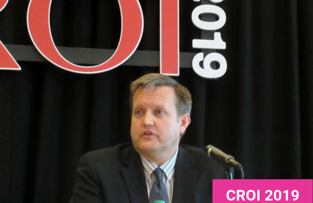Brad Hare presenting at CROI 2019. Photo by Liz Highleyman.