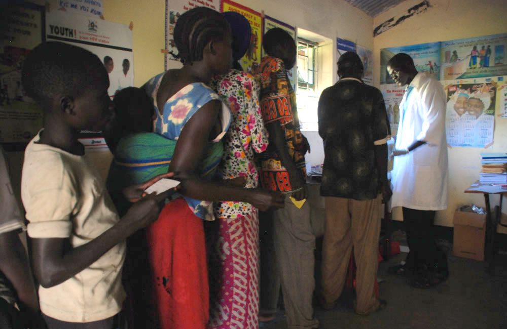 Villagers line up to get tested for HIV in a makeshift laboratory in Uganda. Victoria Holdsworth/Commonwealth Secretariat. Creative Commons licence