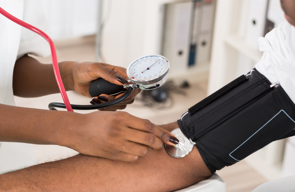 Andrey_Popov/Shutterstock.com A man having his blood pressure tested.