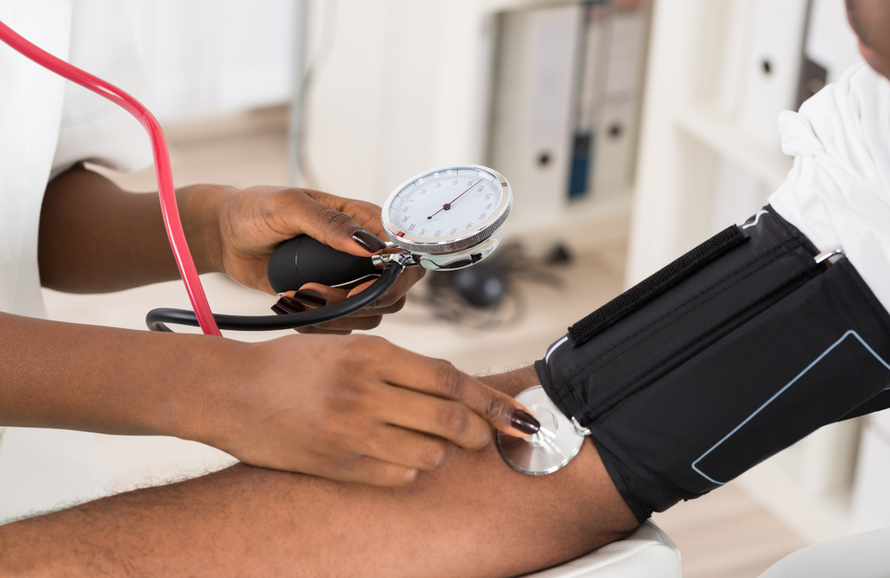 A man having his blood pressure tested.