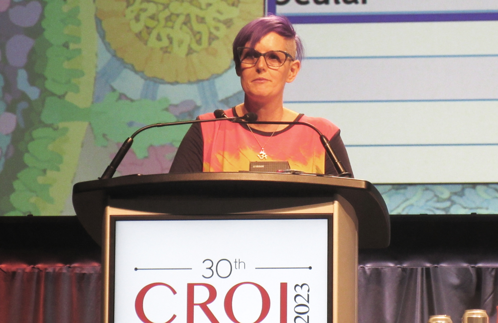 Professor Chloe Orkin presenting at CROI 2023. Photo by Liz Highleyman.
