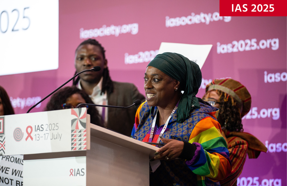 Yvette Raphael at IAS 2025. ©Jacques Nkinzingabo/IAS. CC BY-SA 4.0. Yvette Raphael at IAS 2025. Yvette is talking into a microphone at a podium.