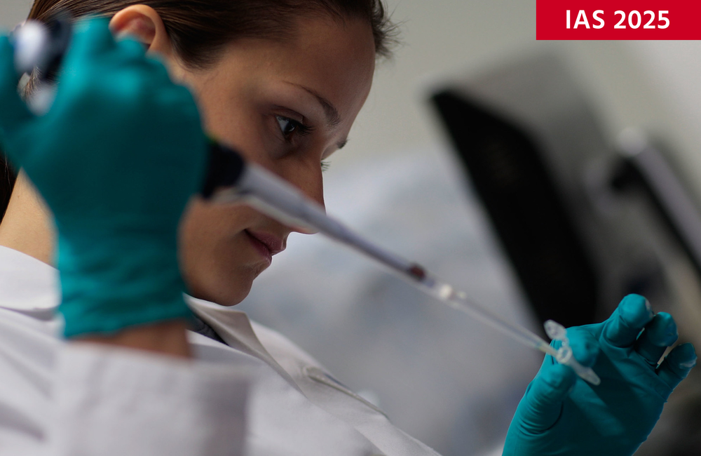 Image: © 2008 Getty Images for International AIDS Vaccine Initiative (IAVI). Creative Commons licence. A woman in a white coat and blue gloves in a laboratory holds a pipette.