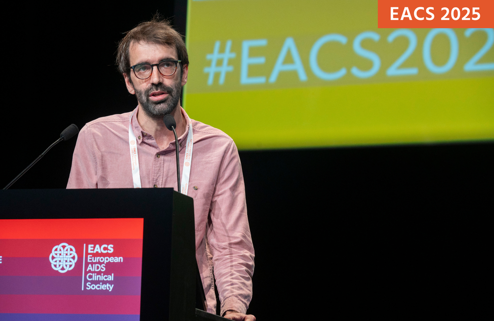 Dr Alberto Foncillas presenting the Barcelona study at EACS 2025. Photo by Christopher Klettermayer Photography. Dr Alberto Foncillas presenting the Barcelona study at EACS 2025. He is speaking at a podium in front of a screen.