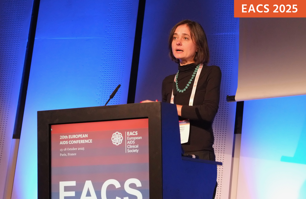 Tetiana Deshko presenting at EACS 2025. Photo by Roger Pebody. Tetiana Deshko presenting at EACS 2025. She is talking into a microphone at a podium.