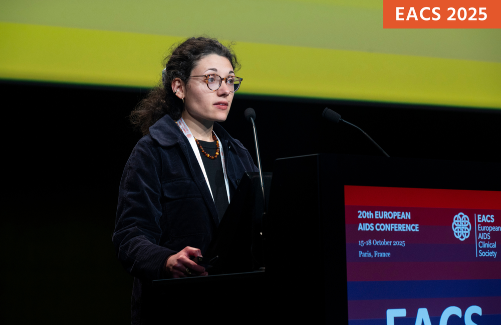Dr Sophie Novelli at EACS 2025. She is standing at a podium, talking into a microphone.